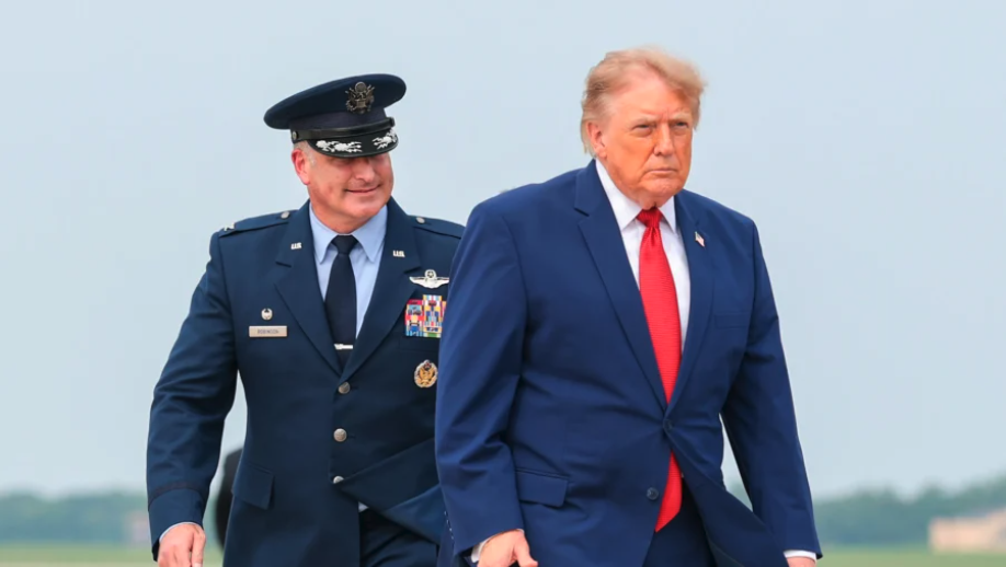 President Donald Trump is accompanied by U.S. Air Force Col. Christopher M. Robinson (L) as he walks to board Air Force One at Joint Base Andrews, Md., on Aug. 11, 2026. (Anna Moneymaker/Getty Images)