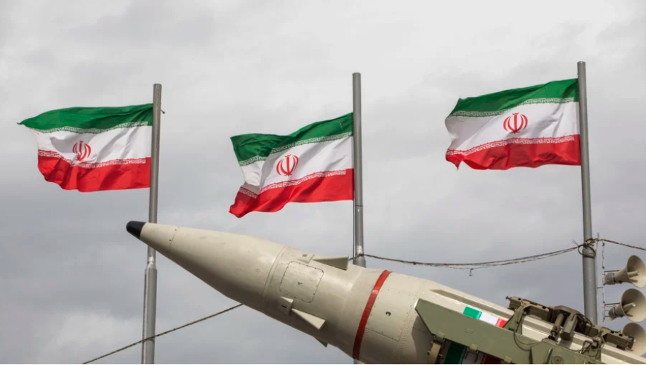 Missiles produced by Iran’s armed forces are displayed near a row of Iranian flags during commemorations to mark the anniversary of the 1979 Iranian Revolution in Tehran, Iran, on Feb. 11, 2026. (Majid Saeedi/Getty Images)