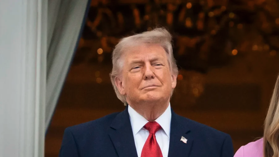 President Donald Trump listens while First Lady Melania Trump speaks during the annual Congressional Picnic on the South Lawn of the White House in Washington on May 19, 2026. (Madalina Kilroy/The Epoch Times)