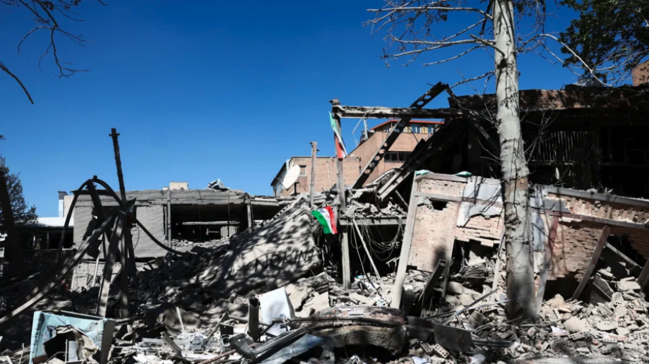 An Iranian flag lies amidst the rubble of a building of the Sharif University of Technology, which was damaged in a strike, amid the U.S.-Israeli conflict with Iran, in Tehran, Iran, on April 7, 2026. (Majid Asgaripour/WANA via Reuters)