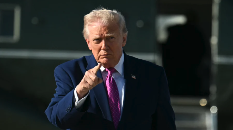 U.S. President Donald Trump gestures after stepping off Marine One at Joint Base Andrews, Md., on April 10, 2026. (Jim Watson / AFP via Getty Images)