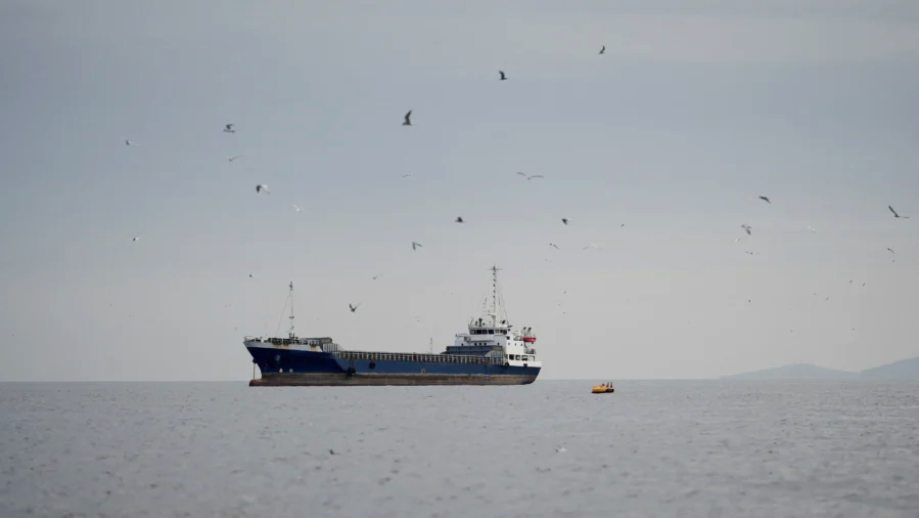 A vessel at the Strait of Hormuz, off the coast of Oman’s Musandam province, on April 12, 2026. (Reuters)